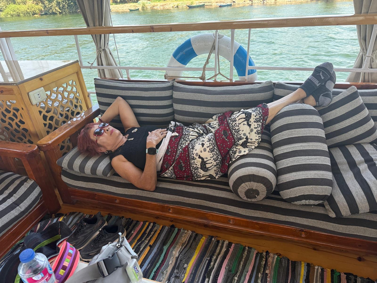 An unhurried afternoon on the cushioned deck of the dahabiya