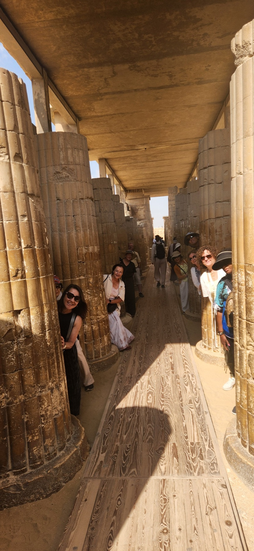 Walking the colonnade between towering temple columns